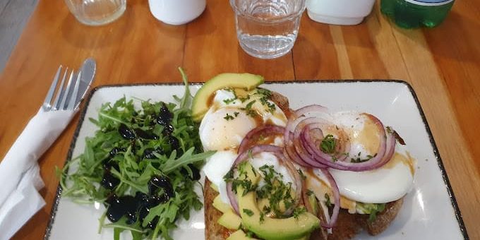 Panem Cafe avocado toast with eggs rucola and onions