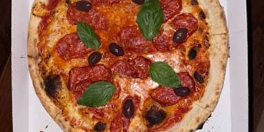 Pizza nostra berlin - pizza pepperoni with basilic and olives