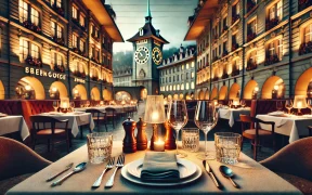 Elegant restaurant table setting with wine glasses and cutlery, set against Bern’s Zytglogge clock tower and Swiss-style buildings in a warm, inviting ambiance.